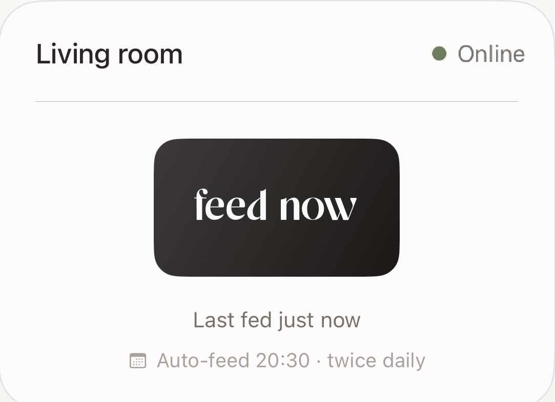 the app's home card — device online, a feed now button, last fed and next scheduled feed
